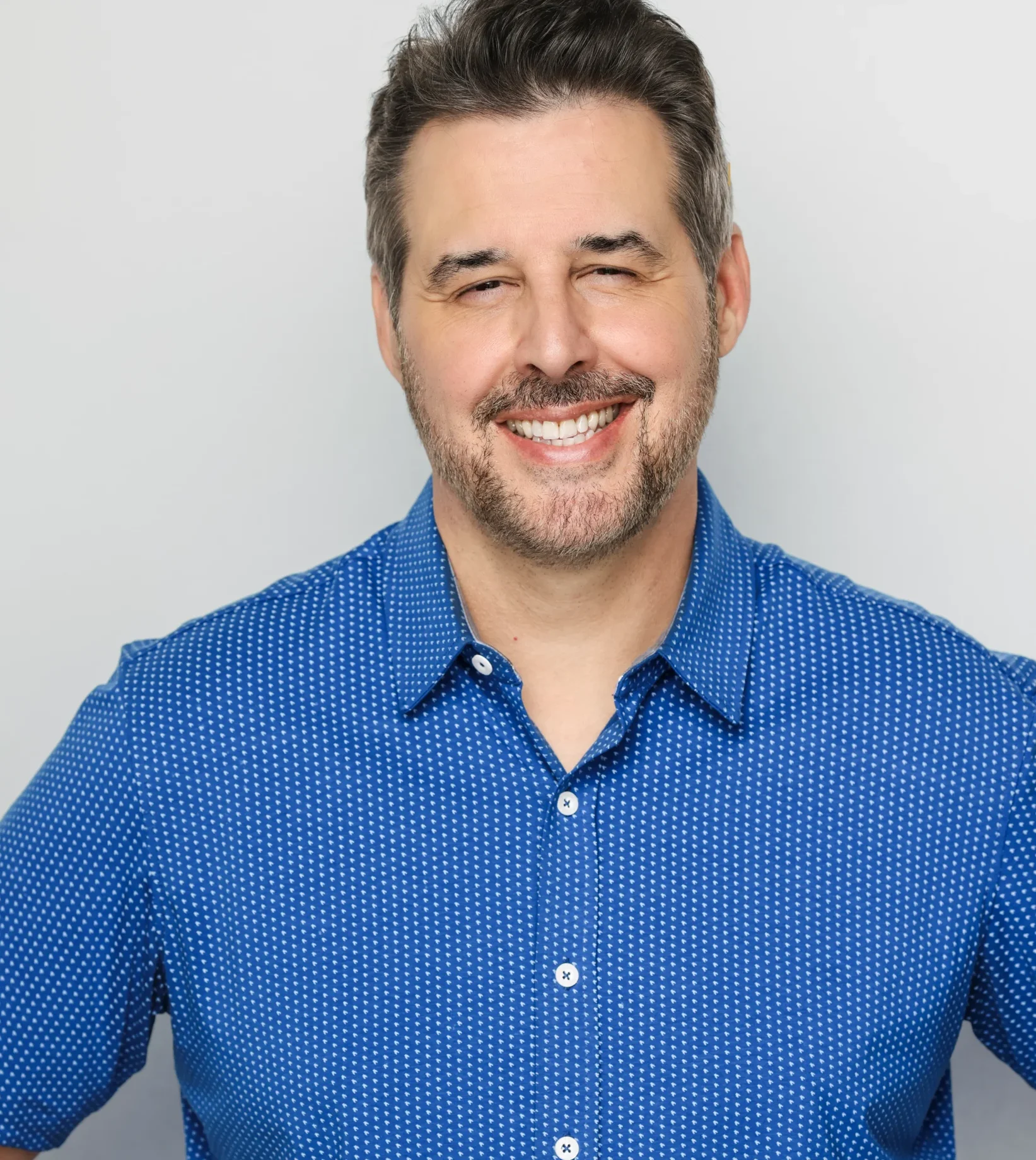 John M Keating smiling