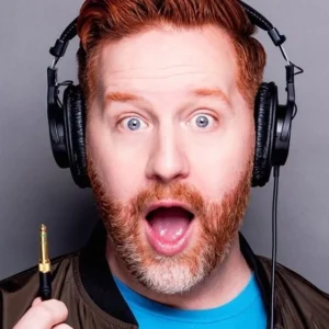 Matt Marr from Reality Gays wearing headphones with a shocked expression on his face